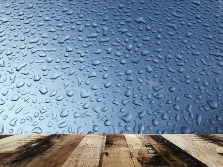 Empty wooden board  with raindrop abstract backgroundの写真素材