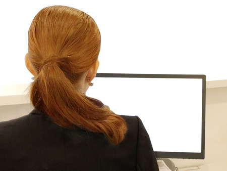 Back side women working blank screen computerの写真素材
