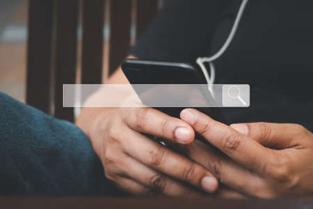 Women use smartphones to search and find what they are interested internet. Technology search engine optimization, searching information data on internet networking concept.の写真素材