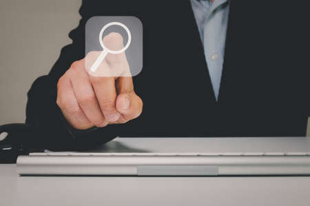 Man point on searching for data Information networking Concept, Business man clicking internet search page touch screen,copy space. data search technology search engine optimization.の写真素材
