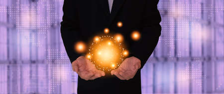 Business man holding abstract circle networks for data information on cloud computing network concept.の写真素材