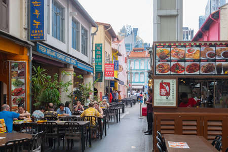 SINGAPORE - April 8, 2019: Singapore Chinatown, Many people or tourists are dining food street chiness market or street style authentic food.のeditorial素材