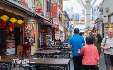 SINGAPORE - April 8, 2019: Singapore Chinatown, Many people or tourists are walking food street chiness market or street style authentic food.のeditorial素材