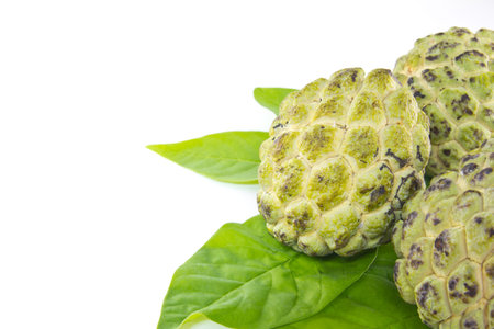 Custard apple and leaves on white background