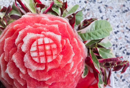 Watermelon carvings on a plate and famous tropical fruits cut professionallyの写真素材