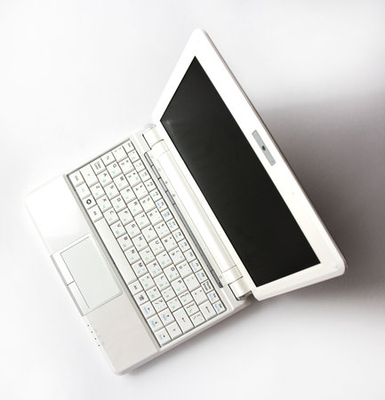 White Laptop against the Light Backgroundの写真素材