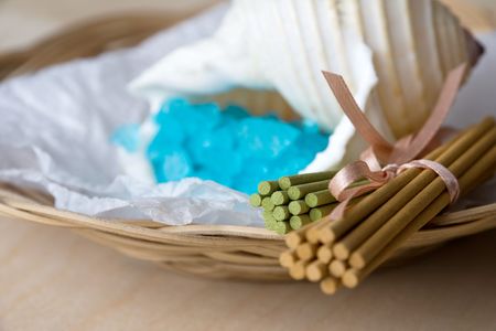 Basket with aromatic sticks and blue bath salt in shellの写真素材