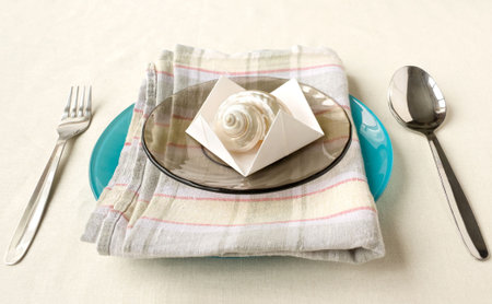 Table appointments with pearl seashellの写真素材