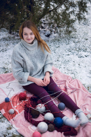 Funny Hipster Girl in Knitted Sweater. Trendy Casual Fashion Outfit in Winter. Toned Photo.