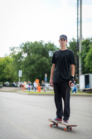 Teenage skateboarder standingの写真素材
