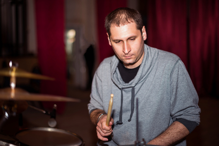 musician playing drums on stageの写真素材