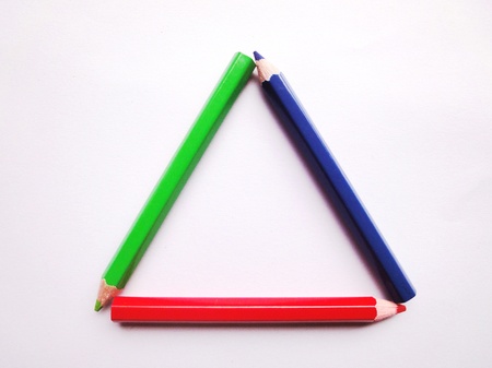 Three Triangle form of pencil colors on white backgroundの写真素材