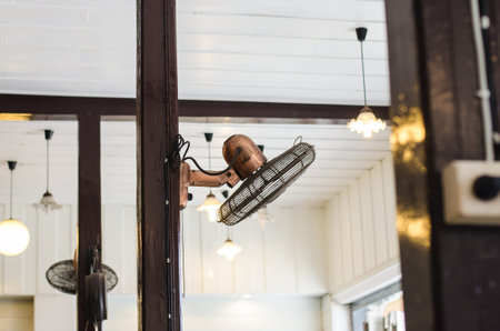 Old fan hanging on the poles