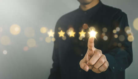 Business man point five stars survey rating icon for customer satisfaction scores. customer satisfaction concept.の写真素材