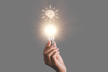Business man holding light bulb. New idea, innovation technology and creative concept.の写真素材