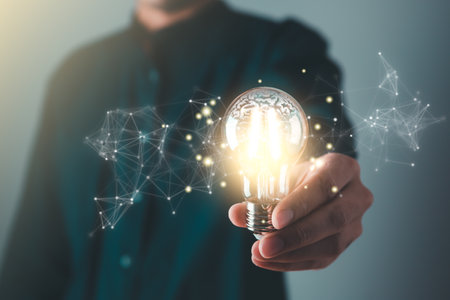 Business man holding light bulb. New idea, innovation technology and creative concept.の写真素材