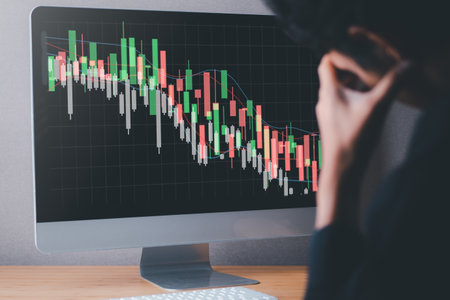 Business man and declining graph screen. Financial and Economic concept. Stock market and Cryptocurrency graph.の写真素材