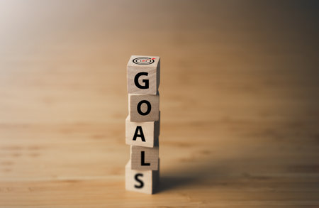 Wooden block with text GOALS. key performance indicator and businees achievement goal concept.の写真素材
