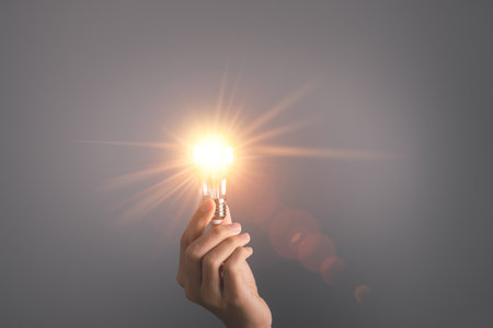 Business man holding light bulb. New idea, innovation technology and creative concept.の写真素材