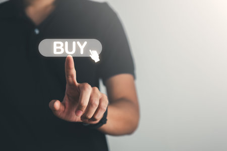Businessman pointing Buy  text and icons. Business, marketing and shopping online concept.