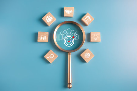 business goal achievement and objective concept.wooden block and maginfier with business icons.の写真素材
