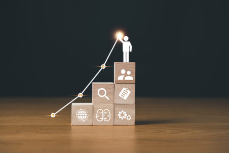 business goal achievement and objective concept.wooden block with business icons.の写真素材