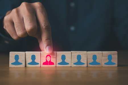 Businessman detecting wooden block of hacker programmer. Digital information technology and  cyber security concept.の写真素材