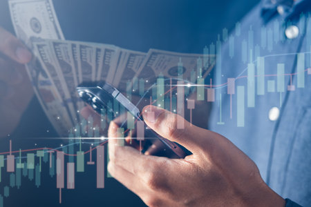 Business using mobile phone with financial graph for business investment growth. Financial, data...