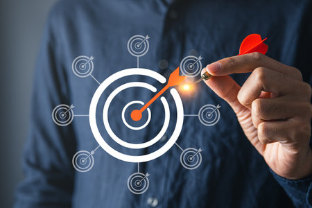 Businessman with goal or target dartboard and loading bar for goal setting in business and strategic plainning achievement concept.の写真素材