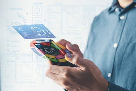 Man use smartphone to manage smart home features including security, lighting, and temperature. Smart home and Iot concept.の写真素材