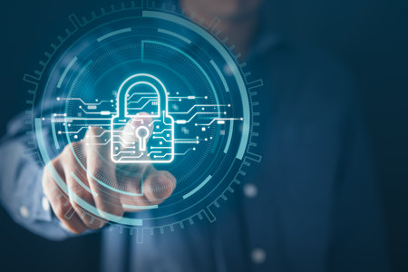 Businessman holding cyber security icons screen. Digital information technology and cyber security concept.の写真素材