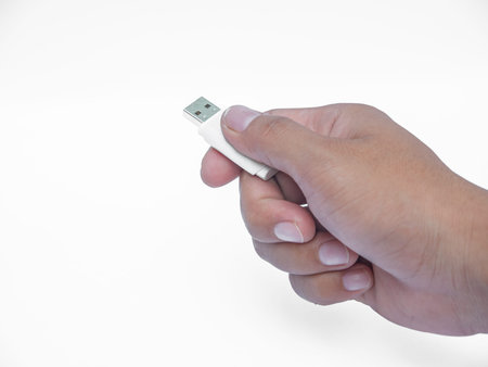Photo of hand holding USBの写真素材
