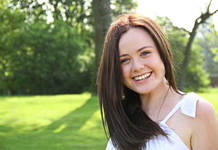 beautiful young lady smiling and looking at the camera. Please view my portfolio for similair imagesの写真素材