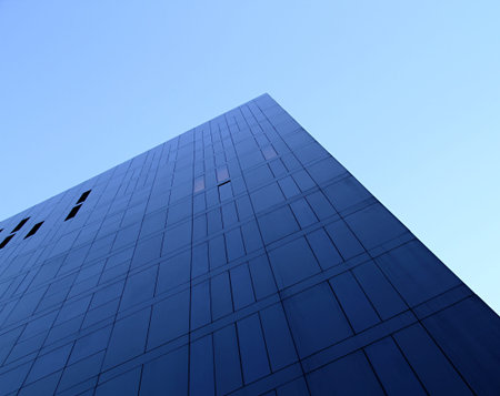 an upwards view of a fresh clean business office block in the day