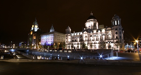 wide angle night shot of the liverpool dock front. Liver building and the customs building is beautifully lit up at night. no property release required.の写真素材
