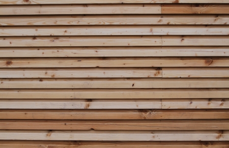 a wooden panel texture with different colours of wood tones runnign through itの写真素材