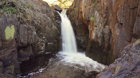 image of a small rocky waterfall の写真素材
