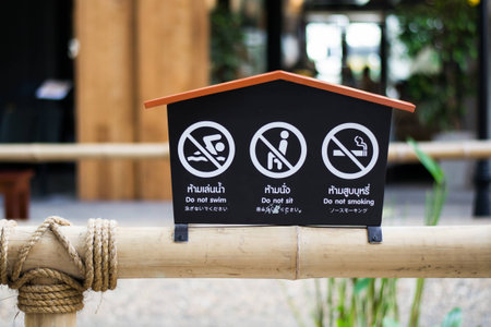 Prohibited sign with English, Japanese and Thai languageの写真素材