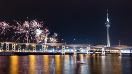 The old Macau-Taipa Bridge and Macau tower with fireworks at new yearの写真素材