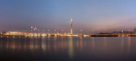 The old Macau-Taipa Bridge and Macau tower with moonの写真素材
