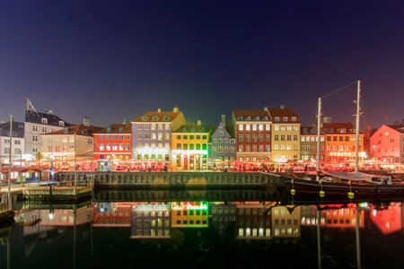 Traveling in the famous Nyhavn, Copenhagen around Autumn seasonの写真素材