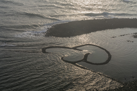 The DOUBLE-HEART STONE TRAP in the Penghu island of Taiwanの写真素材