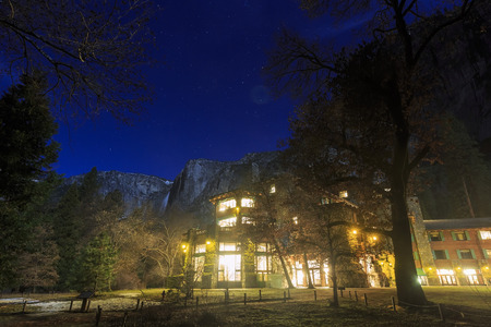 The famous historical Ahwahnee hotel at night with stars and upper Yosemite Fallのeditorial素材