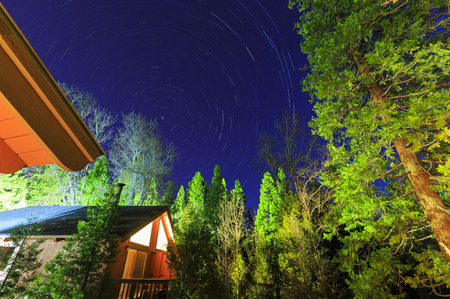 Wooden house with star trail at Bass Lake, Californiaのeditorial素材