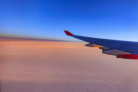 Beautiful sky while traveling via airplane around sun rise timeの写真素材