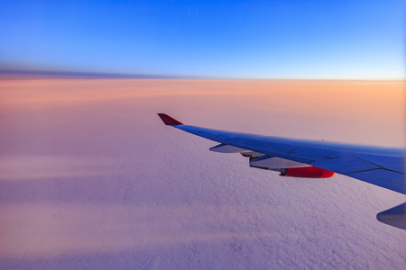 Beautiful sky while traveling via airplane around sun rise timeの写真素材