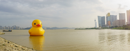 The famous yellow duck art show in Macau around sunset timeのeditorial素材