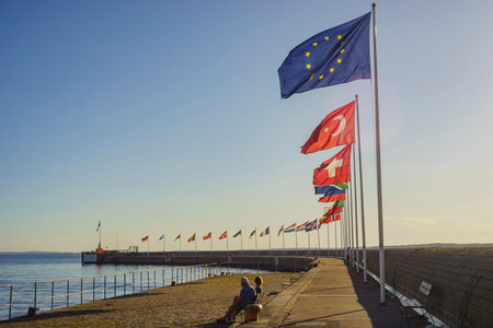 Europe country flags swinging saw at harbour of Helsingborg, Sweden