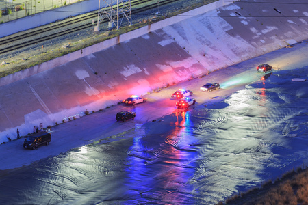 Los Angeles river sunset view with police car belowのeditorial素材