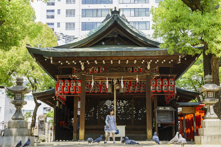 Osaka, APR 29: Old historical temple with a girl below on APR 29, 2011 at Osaka city, Japanのeditorial素材